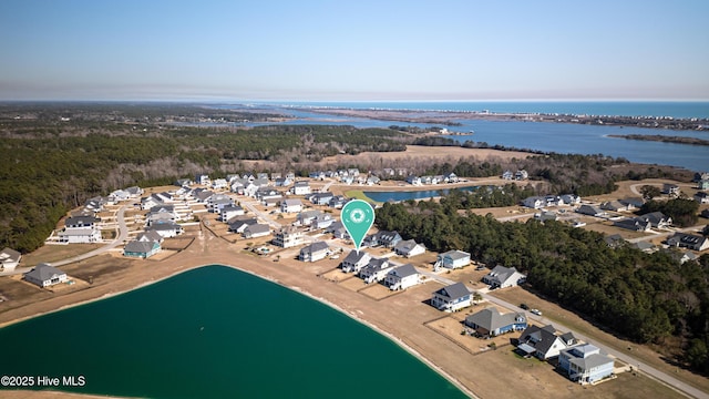 aerial view with a residential view and a water view