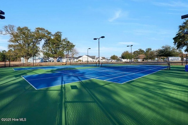 view of sport court with fence