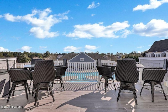 deck featuring a community pool