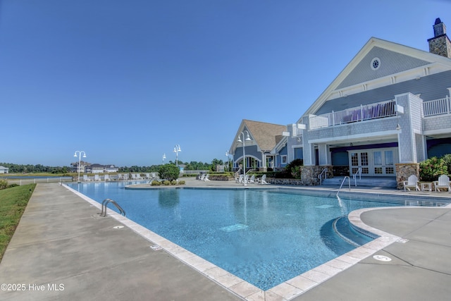 pool featuring french doors and a patio