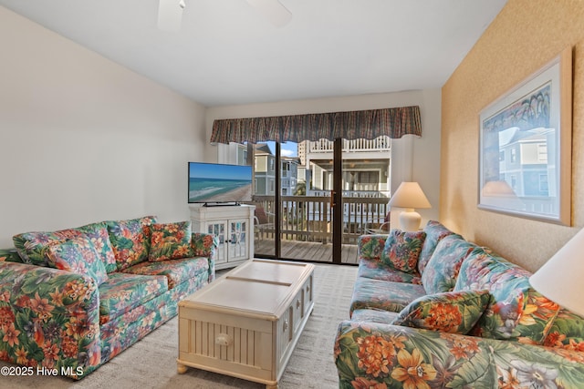 living room with carpet and ceiling fan