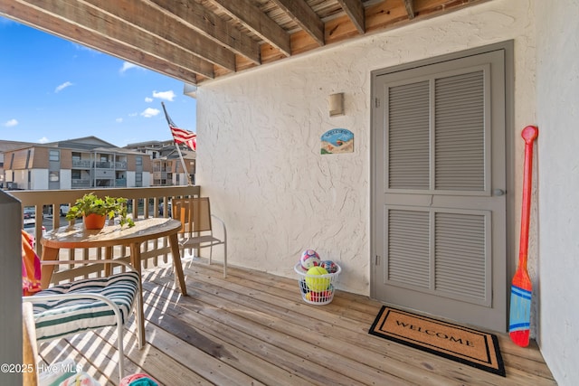 wooden terrace featuring a residential view