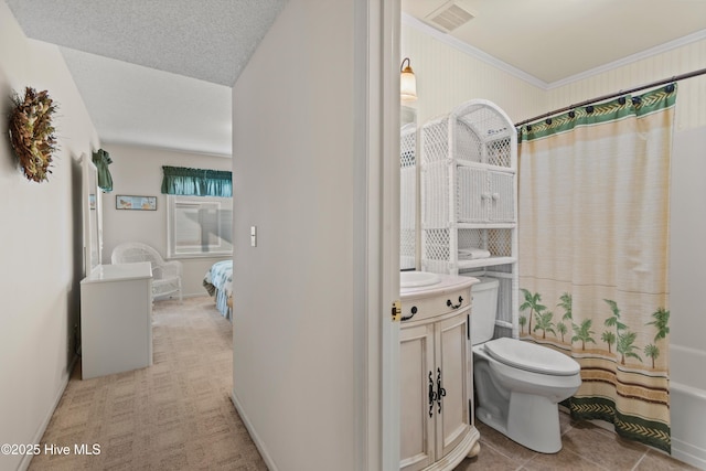 ensuite bathroom featuring vanity, baseboards, visible vents, a textured ceiling, and toilet