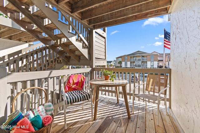 wooden terrace with a residential view