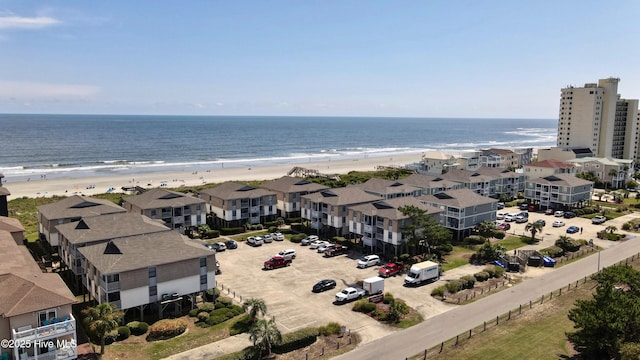 aerial view featuring a water view and a beach view