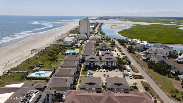 birds eye view of property with a view of the beach and a water view