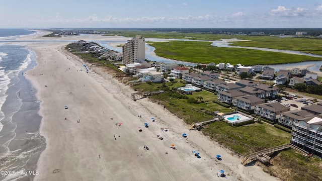 aerial view featuring a water view and a view of the beach