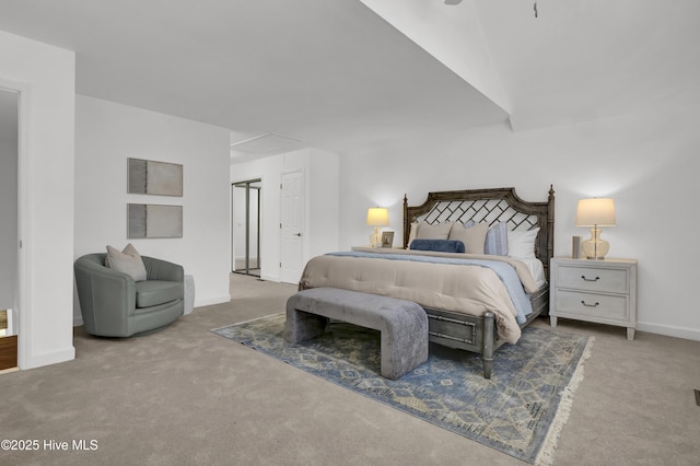 carpeted bedroom with baseboards and attic access