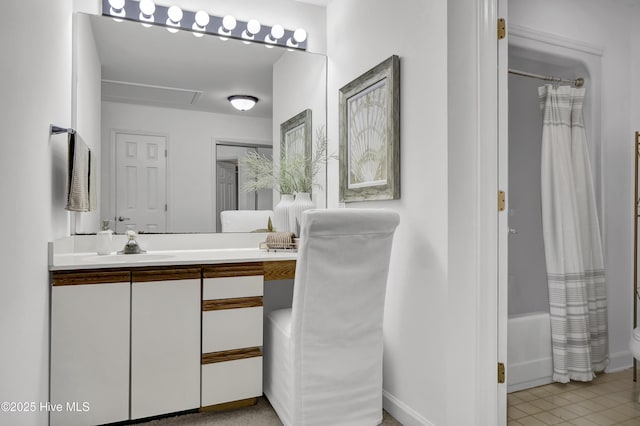 bathroom with shower / bath combination with curtain, vanity, and tile patterned flooring