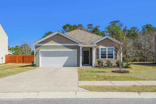 single story home featuring a front lawn, fence, a garage, and driveway