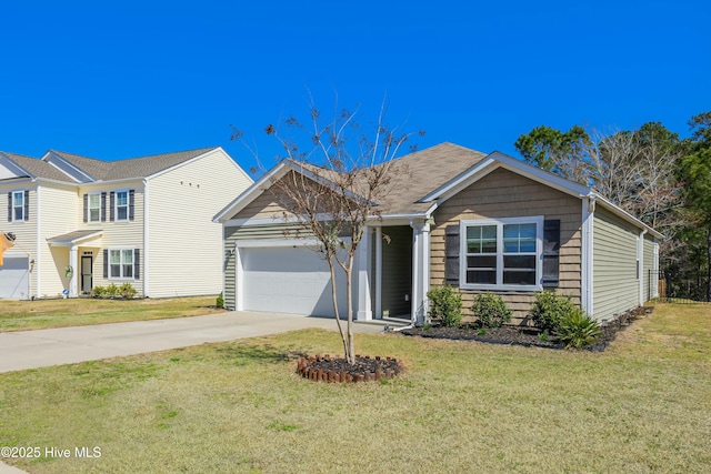 view of front facade featuring driveway, a front yard, and an attached garage