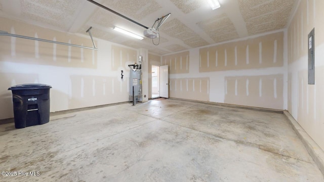 garage with electric water heater and a garage door opener