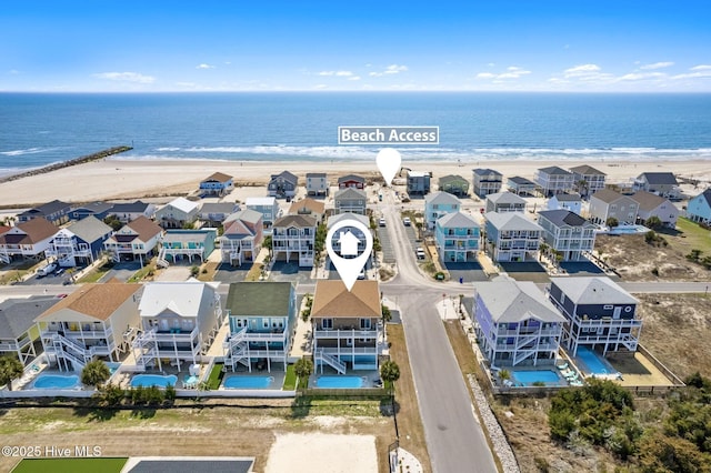 449 E Fourth St, Ocean Isle Beach, NC 28469 - aerial view of residential area featuring a pool and waterfront with a beach