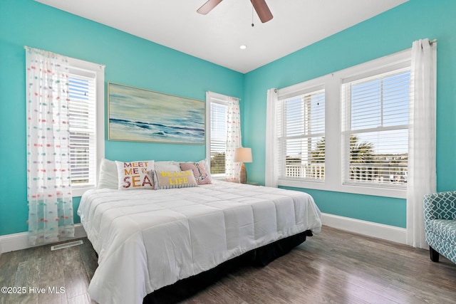 449 E Fourth St, Ocean Isle Beach, NC 28469 - bedroom featuring wood finished floors, baseboards, and a ceiling fan