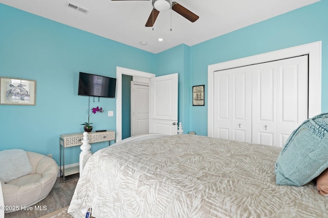 449 E Fourth St, Ocean Isle Beach, NC 28469 - bedroom featuring a closet, wood finished floors, a ceiling fan, and baseboards