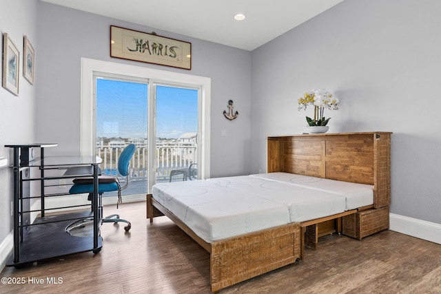 449 E Fourth St, Ocean Isle Beach, NC 28469 - bedroom with wood finished floors, access to outside, baseboards, a desk, and recessed lighting
