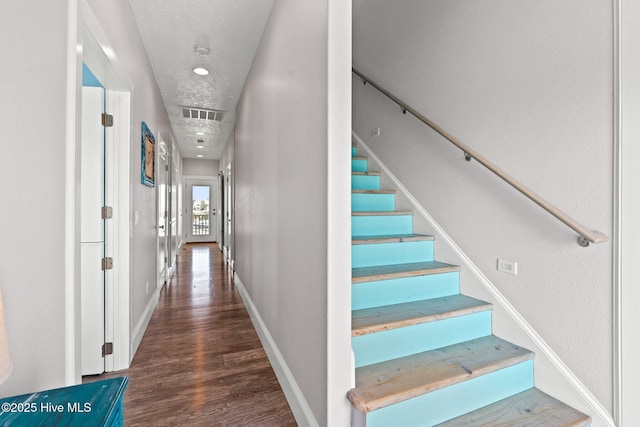 449 E Fourth St, Ocean Isle Beach, NC 28469 - corridor featuring stairs, wood finished floors, and baseboards