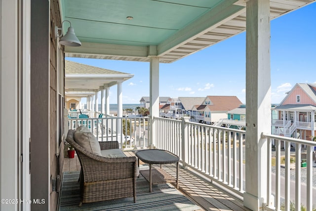 449 E Fourth St, Ocean Isle Beach, NC 28469 - balcony featuring a residential view