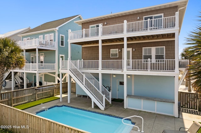 449 E Fourth St, Ocean Isle Beach, NC 28469 - back of property with a patio and a fenced backyard