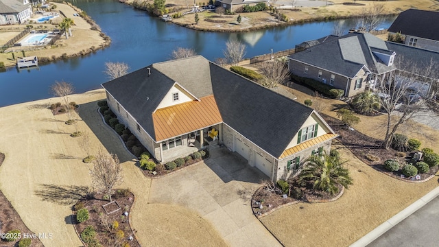 bird's eye view with a water view