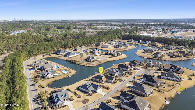 birds eye view of property with a residential view and a water view