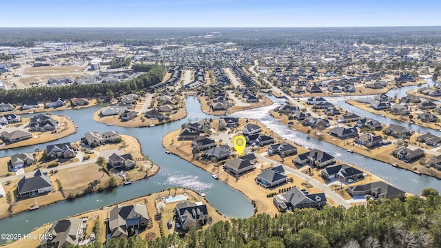 birds eye view of property featuring a residential view and a water view