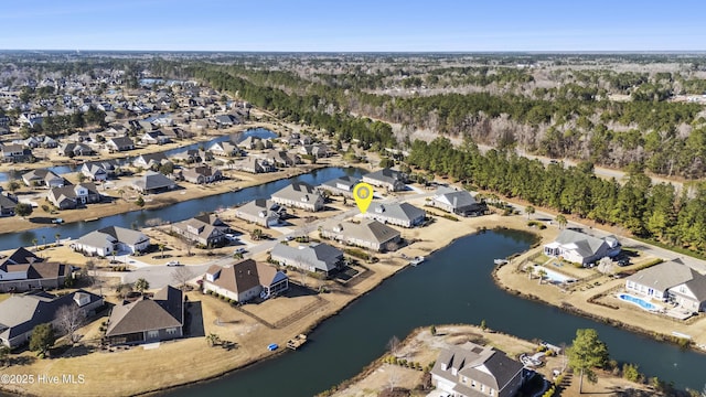 drone / aerial view with a residential view and a water view