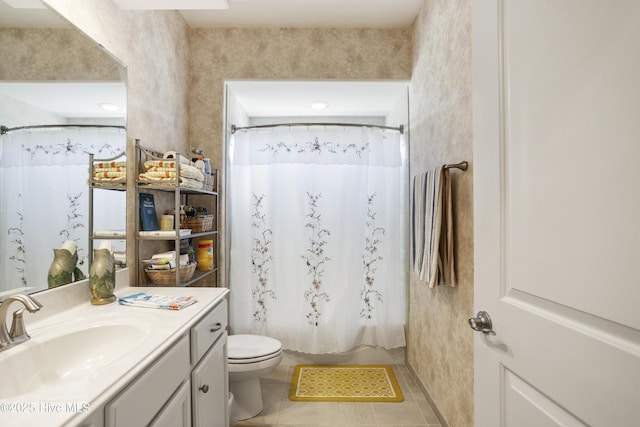 bathroom featuring tile patterned flooring, shower / tub combo with curtain, toilet, and vanity