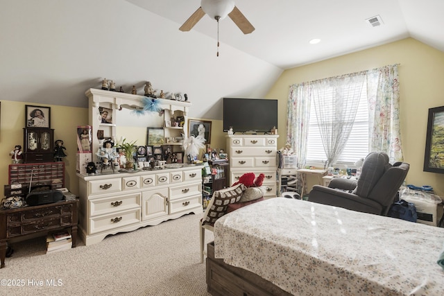 bedroom with visible vents, carpet flooring, a ceiling fan, and vaulted ceiling