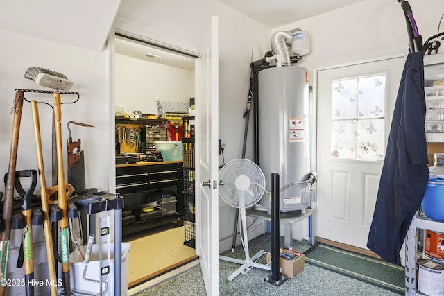 utilities with gas water heater and visible vents