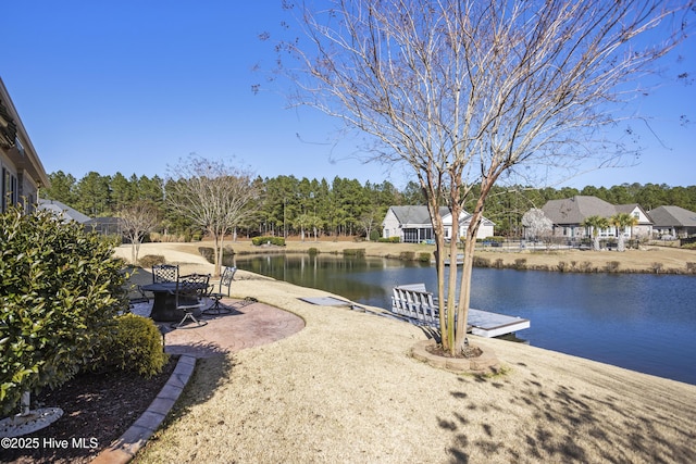 exterior space with a boat dock and a water view