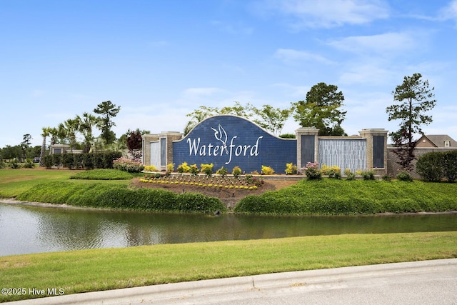 community sign with a water view