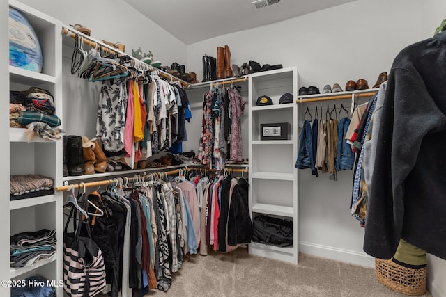 spacious closet featuring carpet flooring and visible vents