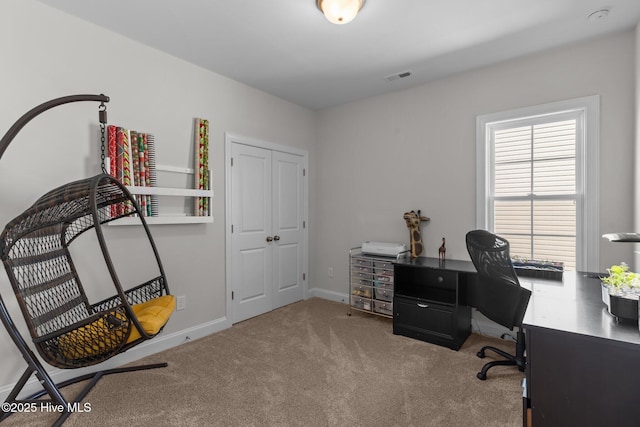 office space featuring carpet, visible vents, and baseboards