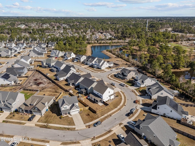 bird's eye view featuring a water view and a residential view