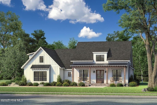 modern inspired farmhouse with covered porch, board and batten siding, a front lawn, and a shingled roof