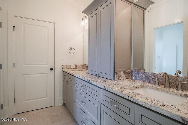 full bath featuring double vanity and a sink