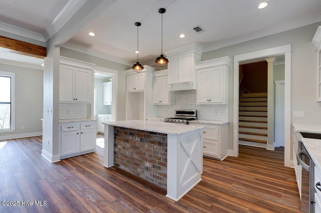 kitchen featuring dark wood-style flooring, white cabinets, visible vents, and appliances with stainless steel finishes