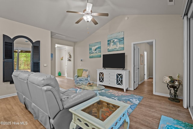 living room with vaulted ceiling, a ceiling fan, light wood-style floors, and baseboards