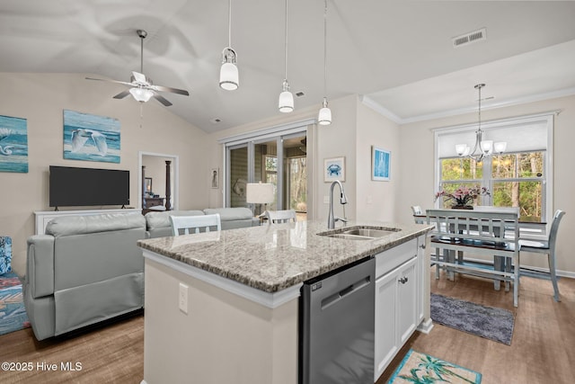 kitchen featuring light stone countertops, light wood-style flooring, a sink, stainless steel dishwasher, and ceiling fan with notable chandelier