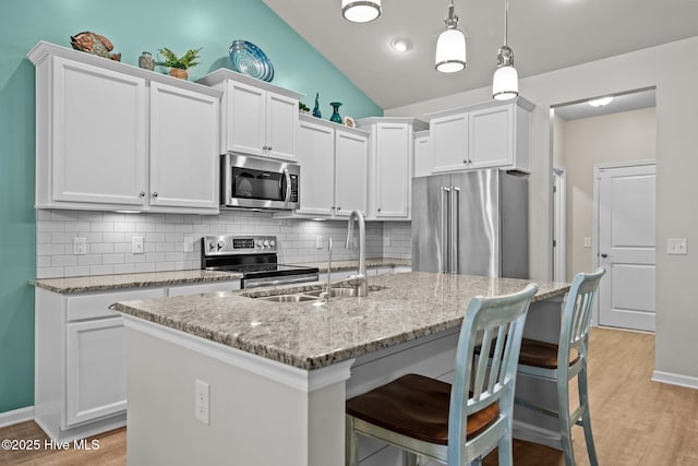 kitchen featuring a sink, white cabinetry, and stainless steel appliances