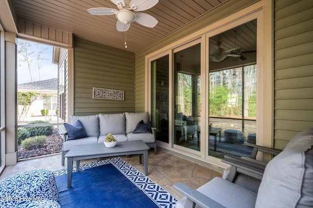 sunroom / solarium with wooden ceiling and a ceiling fan