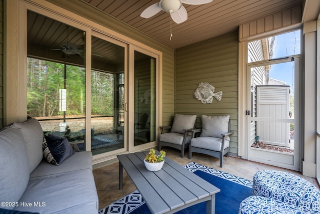 sunroom with wood ceiling and ceiling fan