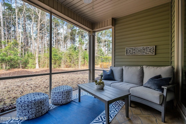 sunroom / solarium featuring wood ceiling