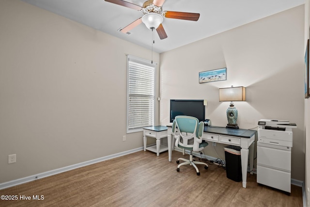 office with light wood finished floors, baseboards, and ceiling fan