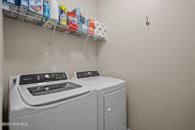 laundry area with separate washer and dryer and laundry area