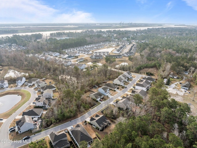 birds eye view of property with a residential view