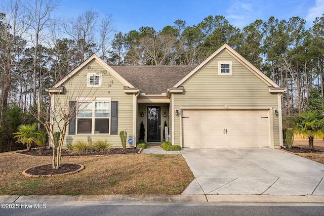 view of front of house with driveway and a garage