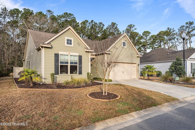 view of front of property featuring a front lawn, a garage, driveway, and roof with shingles