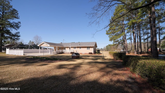 back of house featuring fence